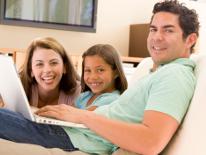 family sitting on couch